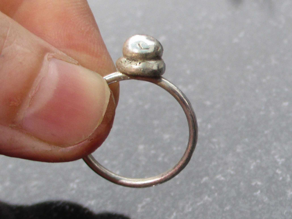 A handmade size 7 silver ball stacking ring made with recycled 925 sterling silv