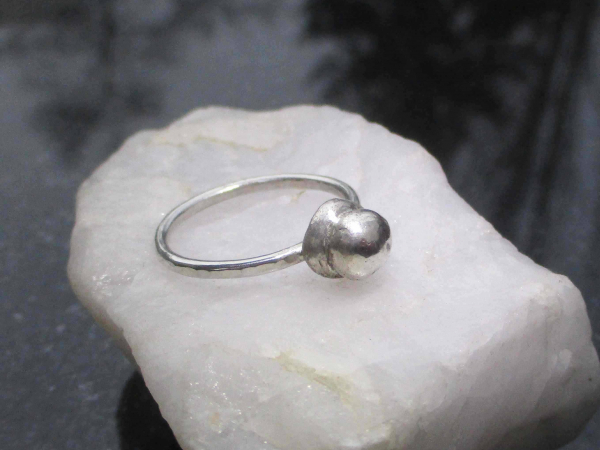 A handmade size 7 silver ball stacking ring made with recycled 925 sterling silv