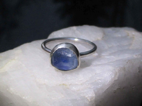 A handmade Blue Kyanite Silver Stacking Ring made with a natural faceted, blue k