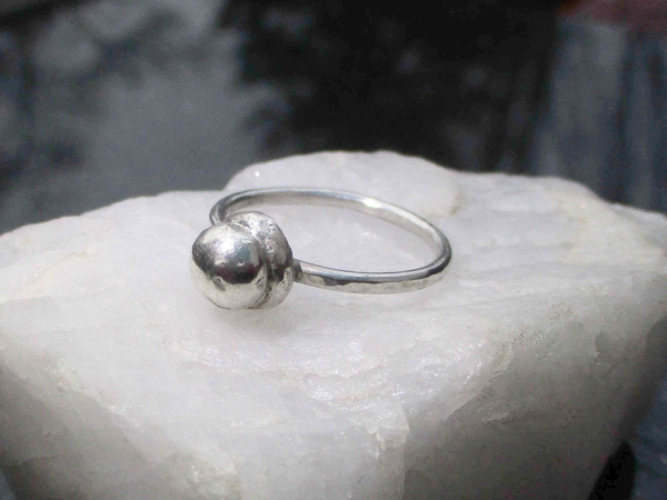 A handmade size 7 silver ball stacking ring made with recycled 925 sterling silv