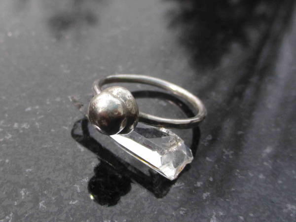 A handmade size 7 silver ball stacking ring made with recycled 925 sterling silv