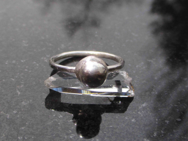 A handmade size 7 silver ball stacking ring made with recycled 925 sterling silv