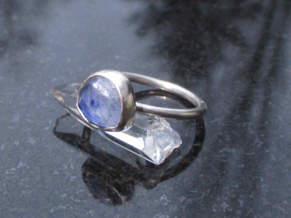 A handmade Blue Kyanite Silver Stacking Ring made with a natural faceted, blue k