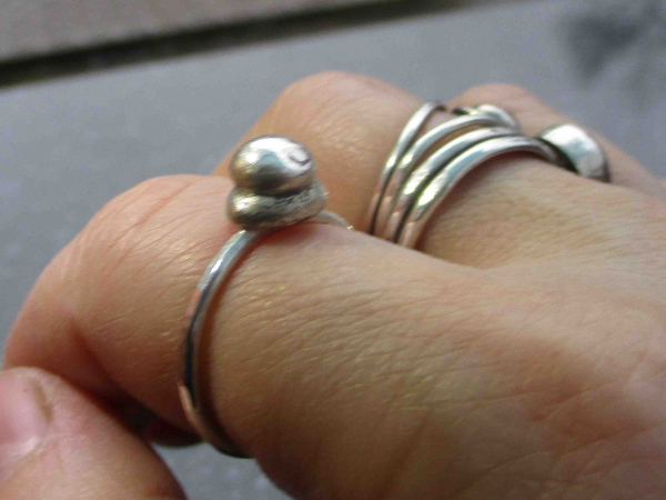 A handmade size 7 silver ball stacking ring made with recycled 925 sterling silv