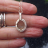 A handmade Oregon sunstone silver necklace. Made with a rough Oregon Sunstone crystal and 925 sterling silver. This Sunstone is clear to light yellow in color and bezel set in a pendant with an open back. Oregon Sunstone is a type of Feldspar and is unique to Oregon! * All 925 Sterling Silver * Necklace Length: 17 Inches * Pendant 1 inch long x 1/2 in. wide * Stone measurements : 4 x 13 x 10 mm.  This necklace is ready to ship. If ordered, you will receive the necklace pictured. Thanks for looki A handmade Oregon sunstone silver necklace. Made with a rough Oregon Sunstone cr