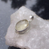 A handmade Oregon sunstone silver necklace. Made with a rough Oregon Sunstone crystal and 925 sterling silver. This Sunstone is clear to light yellow in color and bezel set in a pendant with an open back. Oregon Sunstone is a type of Feldspar and is unique to Oregon! * All 925 Sterling Silver * Necklace Length: 17 Inches * Pendant 1 inch long x 1/2 in. wide * Stone measurements : 4 x 13 x 10 mm.  This necklace is ready to ship. If ordered, you will receive the necklace pictured. Thanks for looki A handmade Oregon sunstone silver necklace. Made with a rough Oregon Sunstone cr